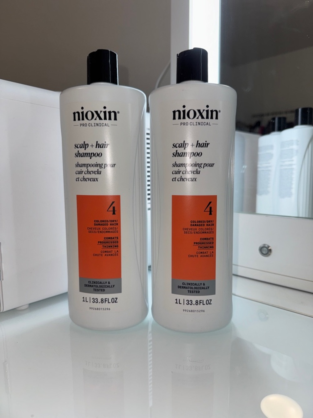 Nioxin Scalp & Hair Shampoo 4 — White Bottle with Orange Label
